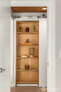 a bedroom with double bed and a window