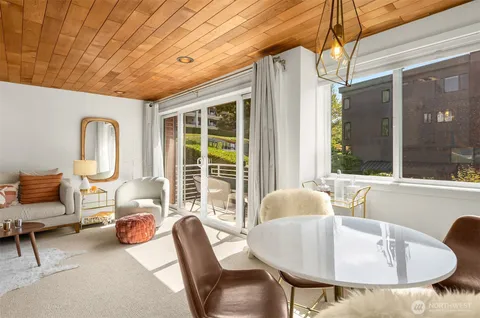 a dining room with furniture and windows