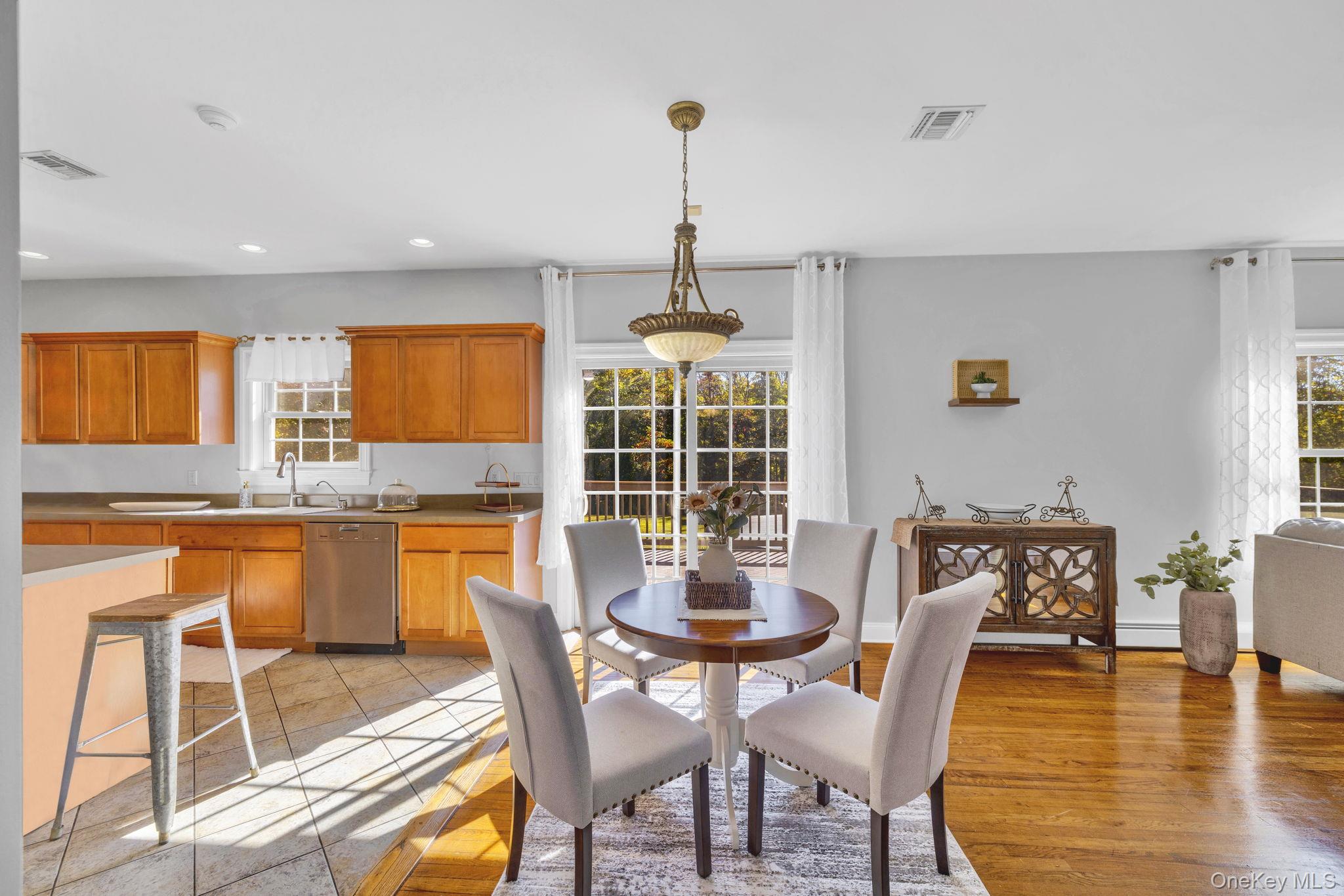 1174 Mountain Road Port Jervis, NY 12771 - Photo 11 of 34 a dining room with furniture window and wooden floor