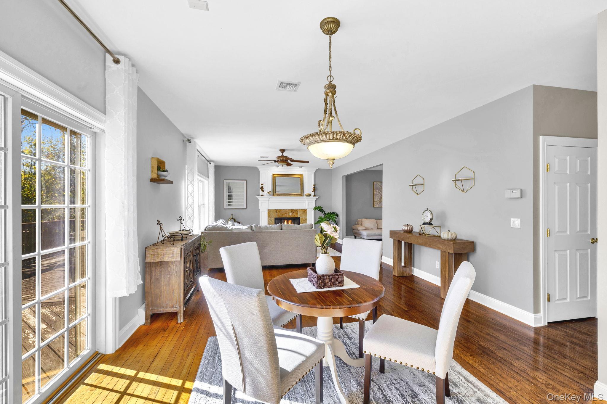 1174 Mountain Road Port Jervis, NY 12771 - Photo 12 of 34 a view of a dining room with furniture window and wooden floor