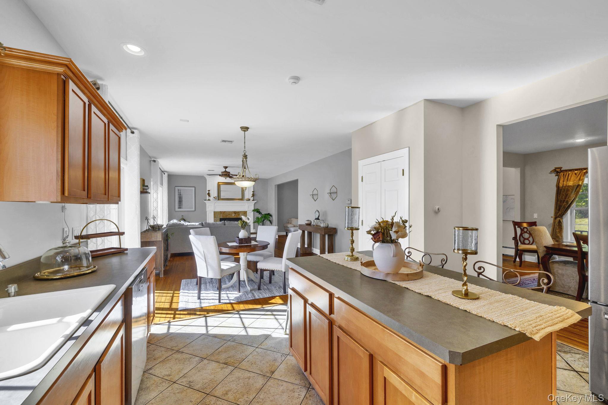 1174 Mountain Road Port Jervis, NY 12771 - Photo 15 of 34 a large kitchen with a table and chairs