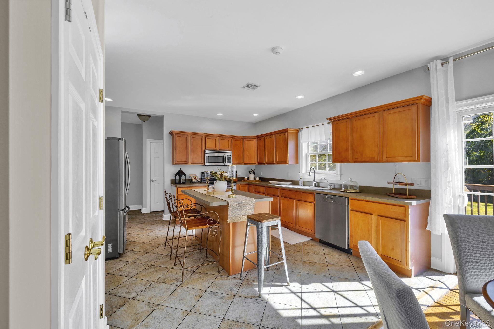 1174 Mountain Road Port Jervis, NY 12771 - Photo 16 of 34 a large kitchen with a table and chairs