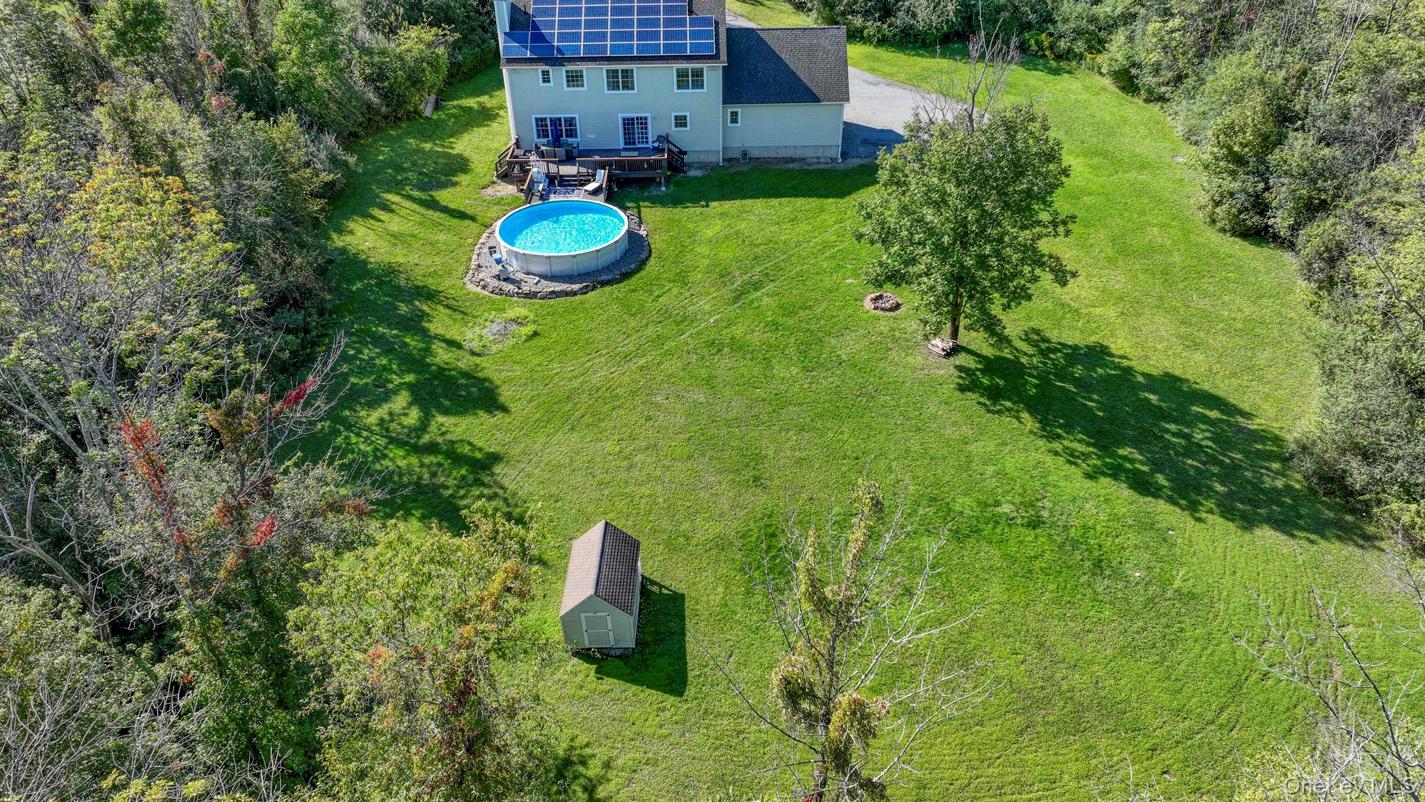 1174 Mountain Road Port Jervis, NY 12771 - Photo 3 of 34 a backyard of a house with seating space