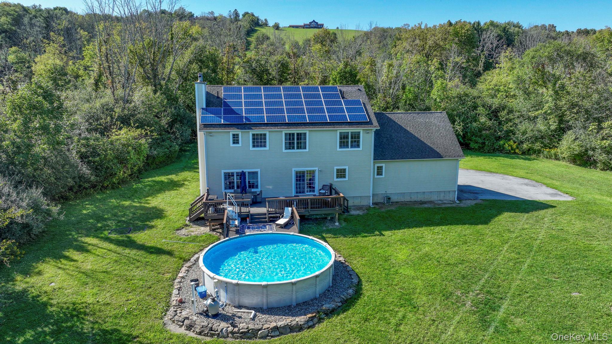 1174 Mountain Road Port Jervis, NY 12771 - Photo 31 of 34 a view of a house with a backyard and a tub