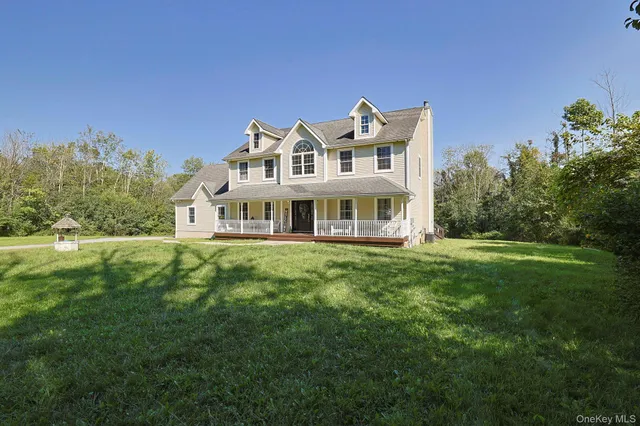 a view of a big yard with large trees