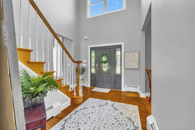 a bedroom with a bed and a potted plant