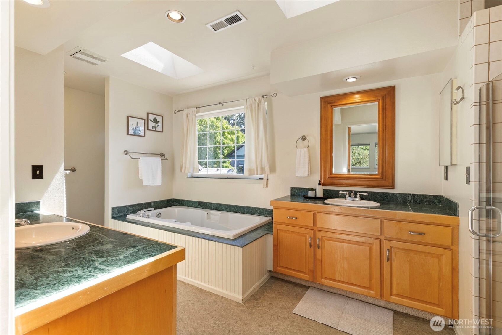 1757 Maple Street Port Townsend, WA 98368 - Photo 18 of 40 a kitchen with granite countertop a sink stove and cabinets