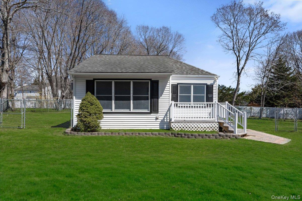 819 Canal Road Mount Sinai, NY 11766 - Photo 2 of 33 Charming single-story property featuring white siding and dark shutters