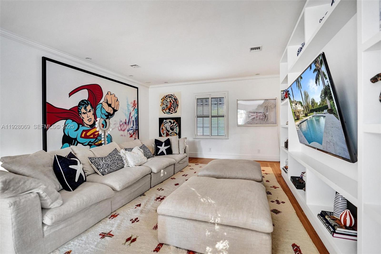 1281 Banyan Road Boca Raton, FL 33432 - Photo 41 of 69 a living room with furniture and a flat screen tv