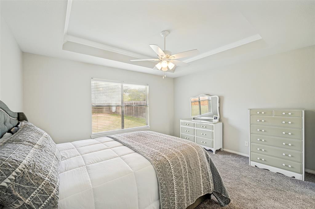 206 Ridge View Court Decatur, TX 76234 - Photo 19 of 29 a bedroom with a large bed and a window