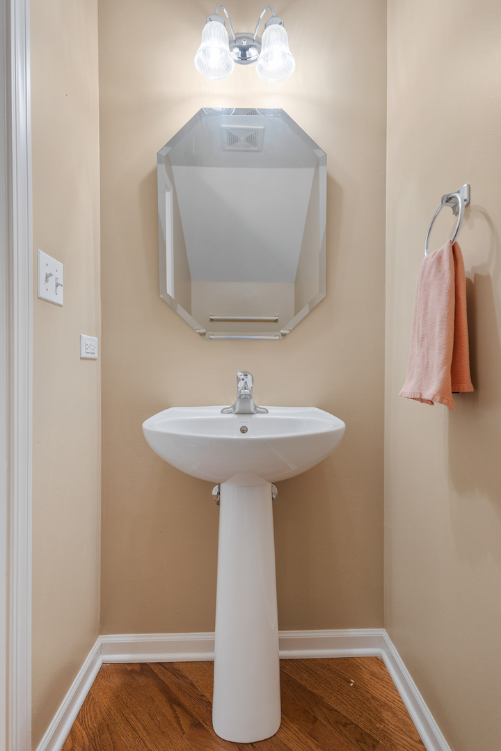 2451 Anna Way Elgin, IL 60124 - Photo 13 of 26 a bathroom with a sink and a mirror