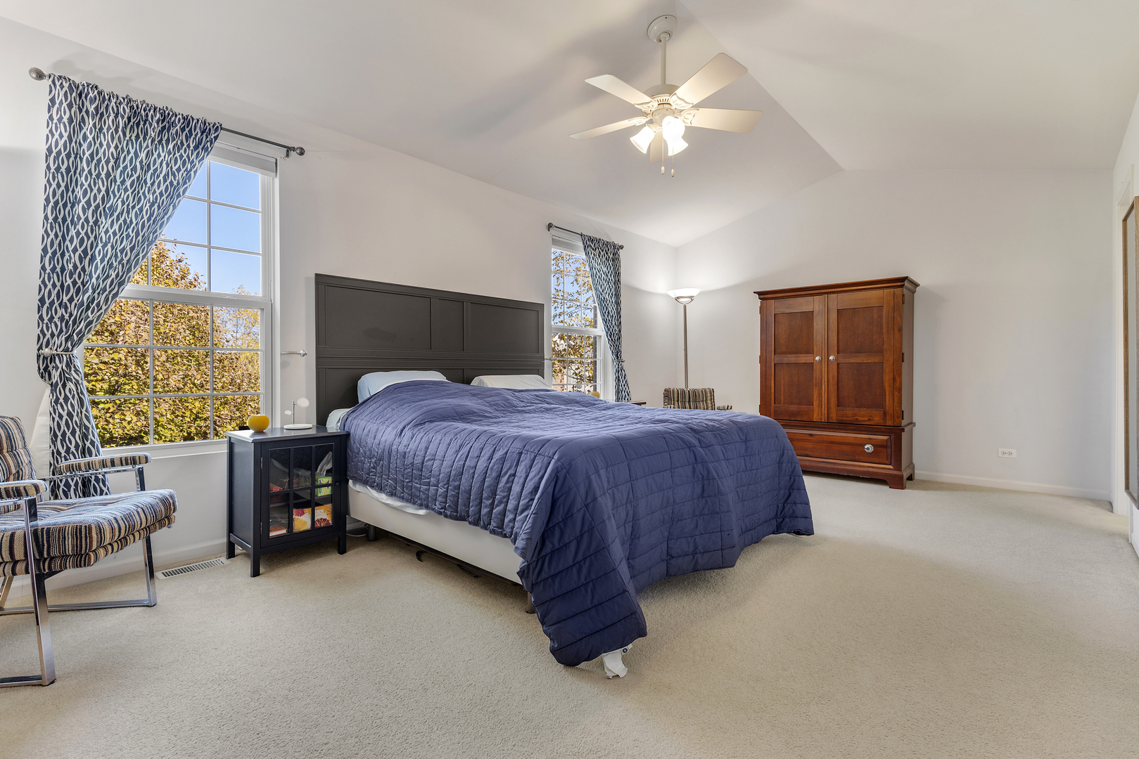 2451 Anna Way Elgin, IL 60124 - Photo 16 of 26 a spacious bedroom with a bed and a chandelier