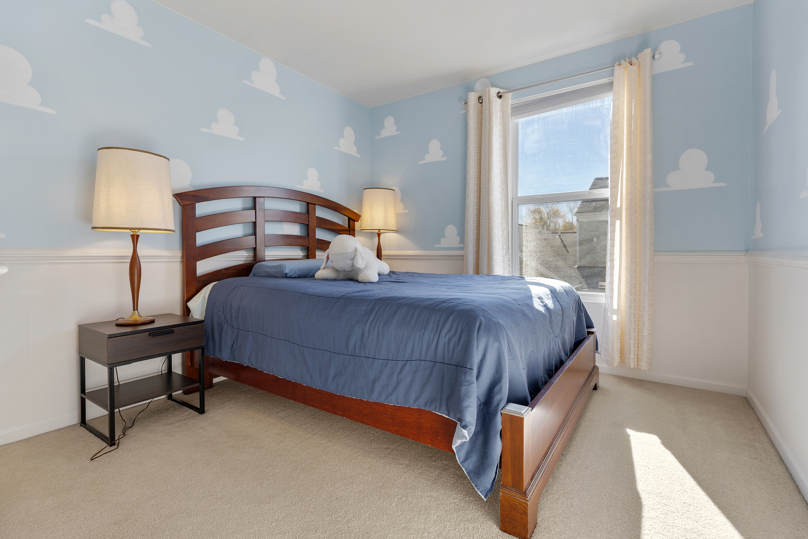 2451 Anna Way Elgin, IL 60124 - Photo 22 of 26 a bedroom with a bed lamp and a window