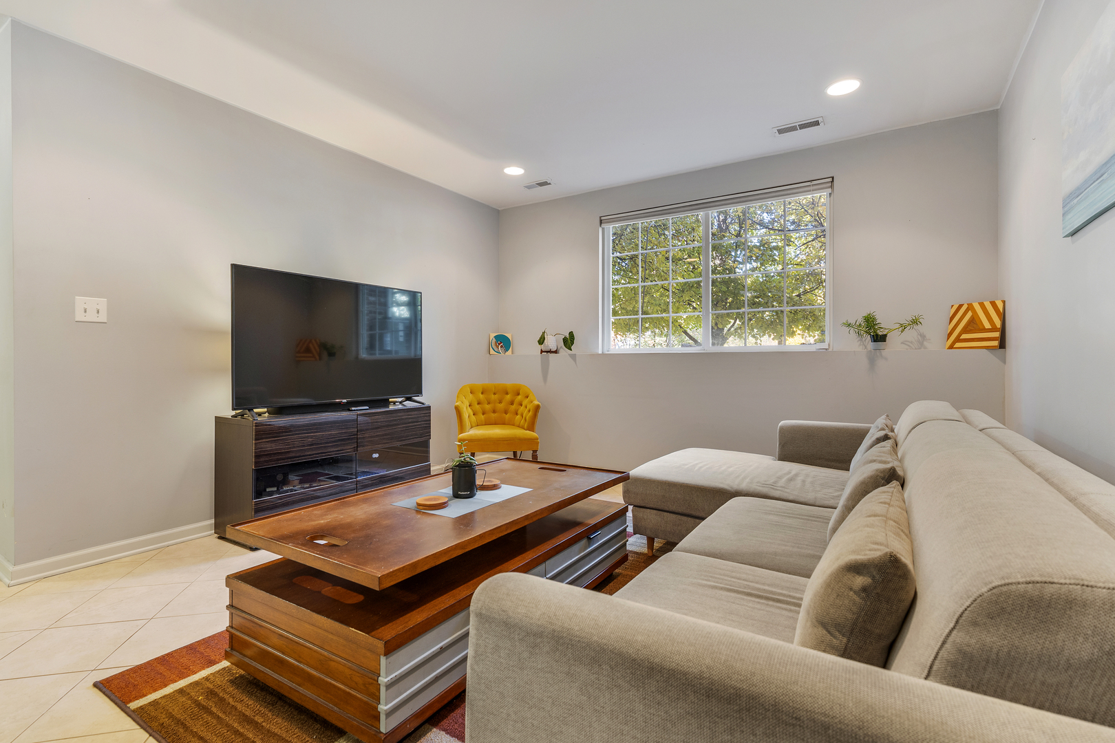 2451 Anna Way Elgin, IL 60124 - Photo 24 of 26 a living room with furniture and a flat screen tv