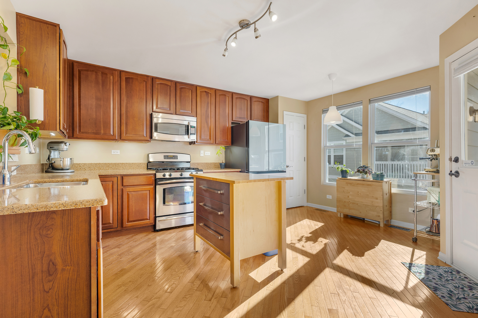 2451 Anna Way Elgin, IL 60124 - Photo 9 of 26 a kitchen with a stove a sink and a refrigerator