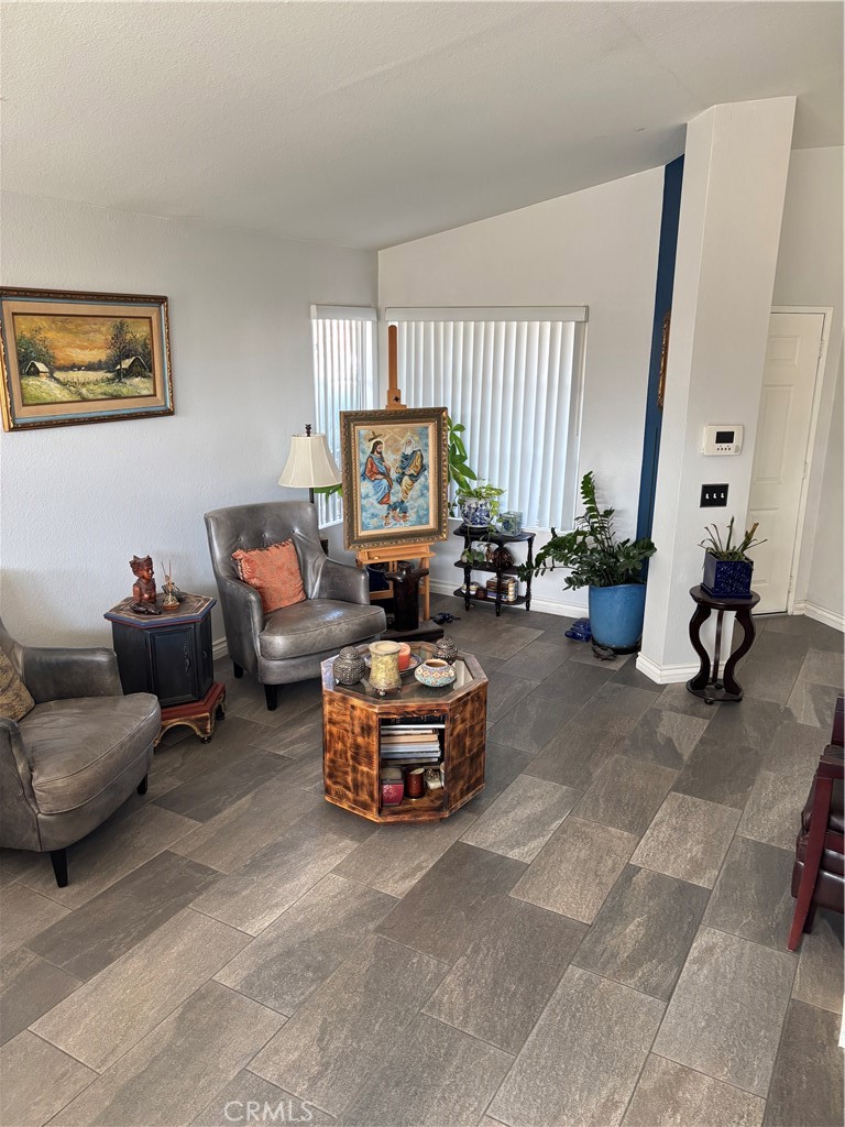 2830-2830 Chuckwagon Road Palmdale, CA 93550 - Photo 11 of 11 a living room with furniture and a large window