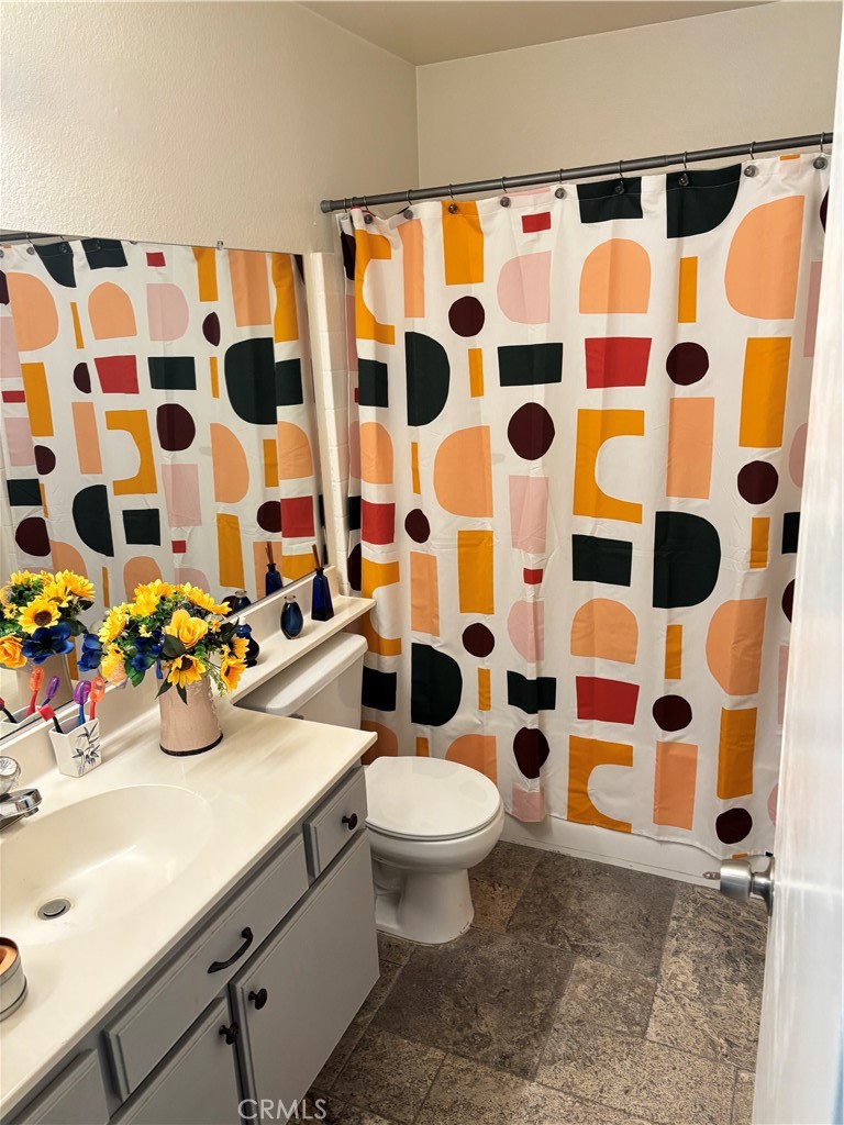 2830-2830 Chuckwagon Road Palmdale, CA 93550 - Photo 3 of 11 a bathroom with a sink and a toilet