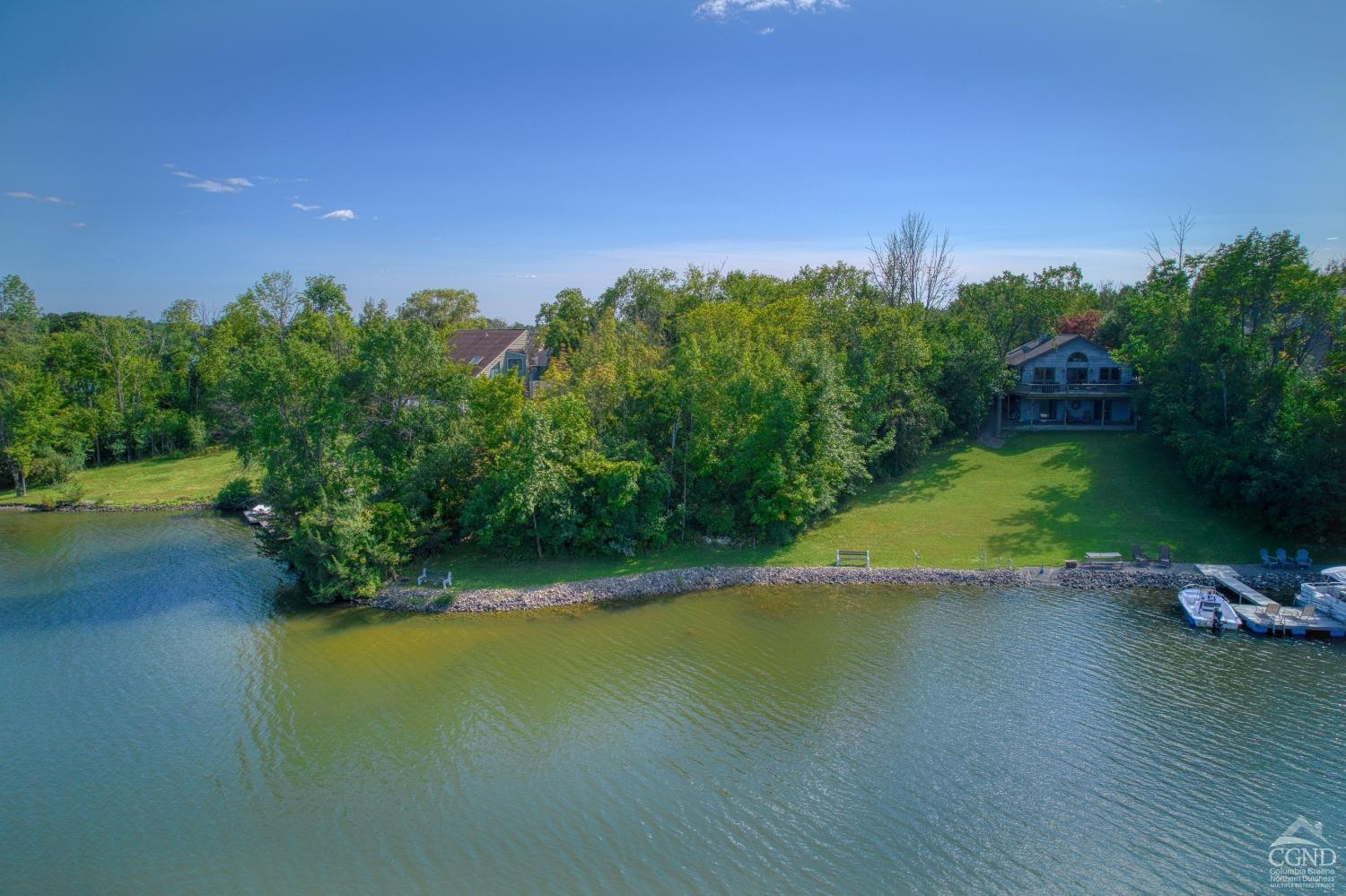 107 Whitney Point Athens, NY 12015 - Photo 16 of 17 a view of a lake with houses in the background
