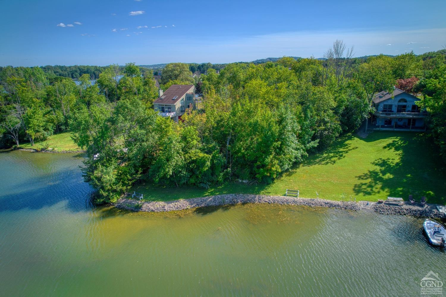 107 Whitney Point Athens, NY 12015 - Photo 9 of 17 a view of a green yard with an trees