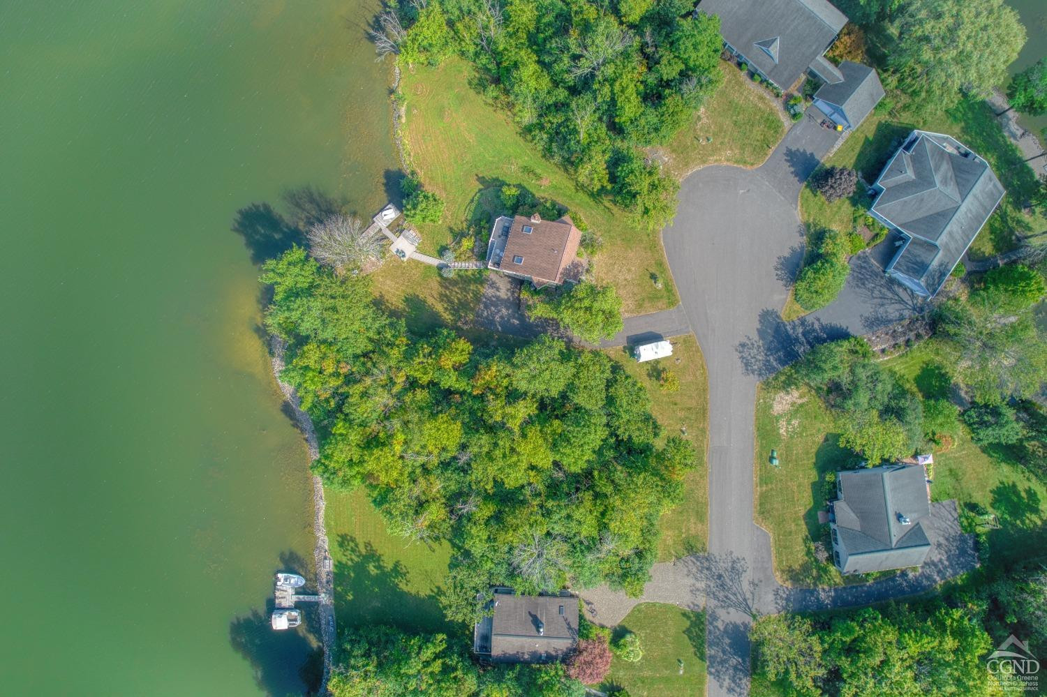 107 Whitney Point Athens, NY 12015 - Photo 10 of 17 an aerial view of a house with a yard lake and trees all around