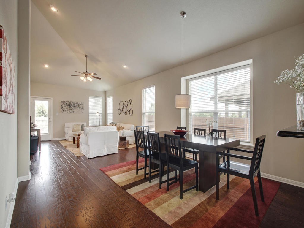 13900 Marathon Road Austin, TX 78717 - Photo 5 of 30 From previous owners photos, this is the dining and living room area view. Slanted high ceilings, recessed lighting and wall of windows allow natural lighting to filter through.