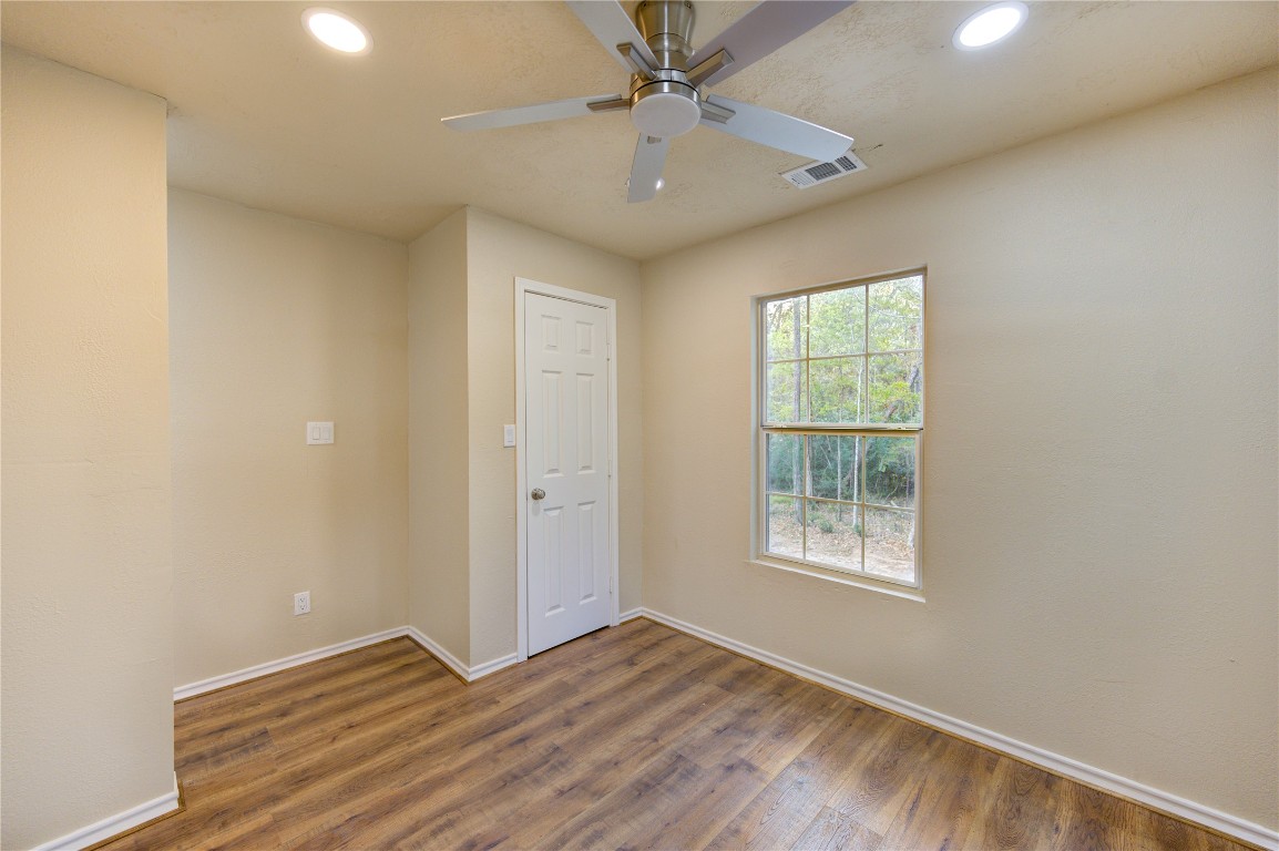 235 6th Street Trinity, TX 75862 - Photo 17 of 29 wooden floor in an empty room with a window