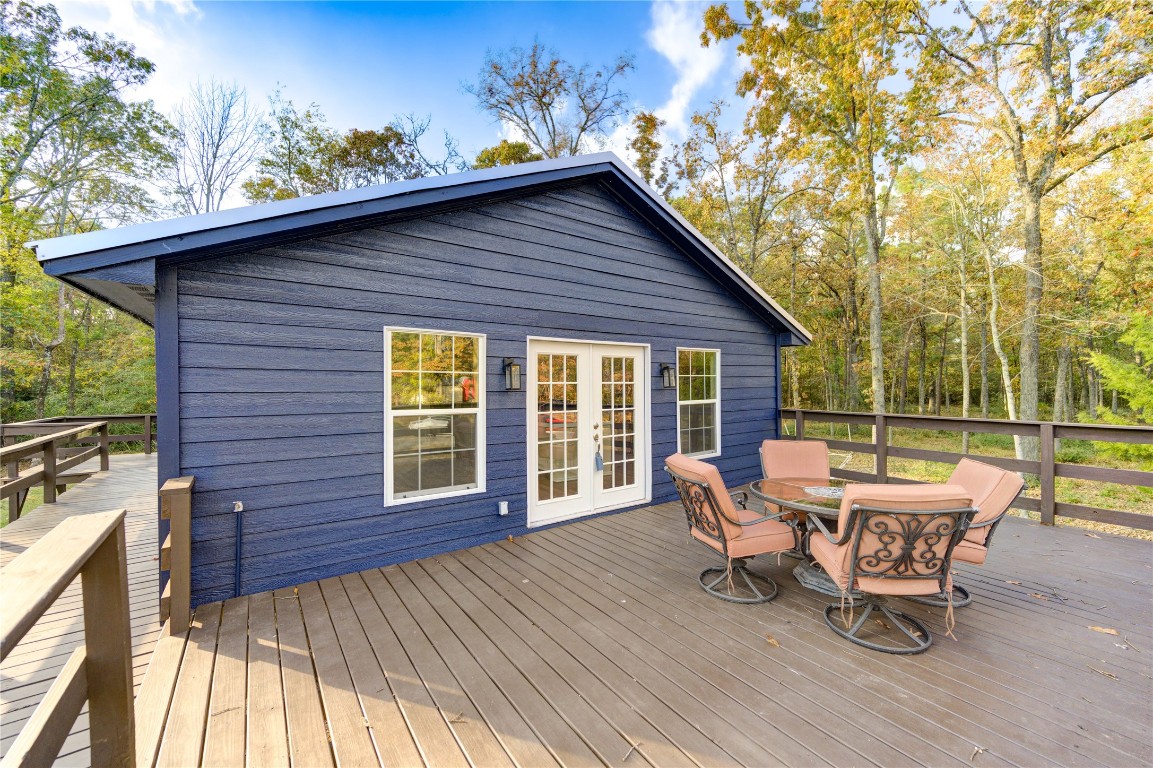 235 6th Street Trinity, TX 75862 - Photo 3 of 29 a view of a house with backyard sitting area and garden