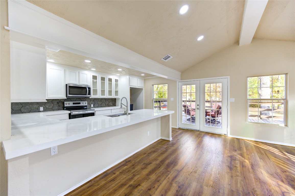 235 6th Street Trinity, TX 75862 - Photo 4 of 29 a large white kitchen with lots of counter top space a sink and appliances