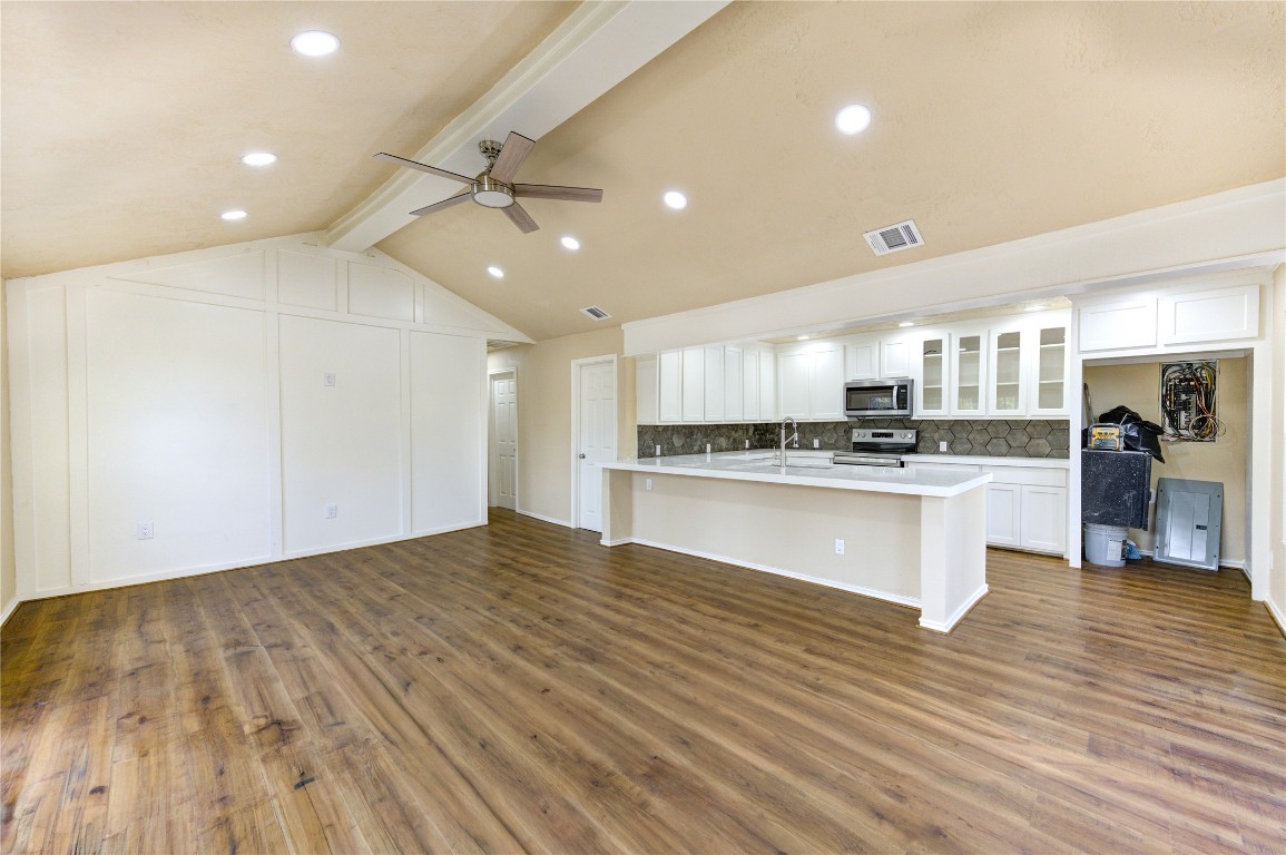 235 6th Street Trinity, TX 75862 - Photo 9 of 29 a view of kitchen center island wooden floor and appliances