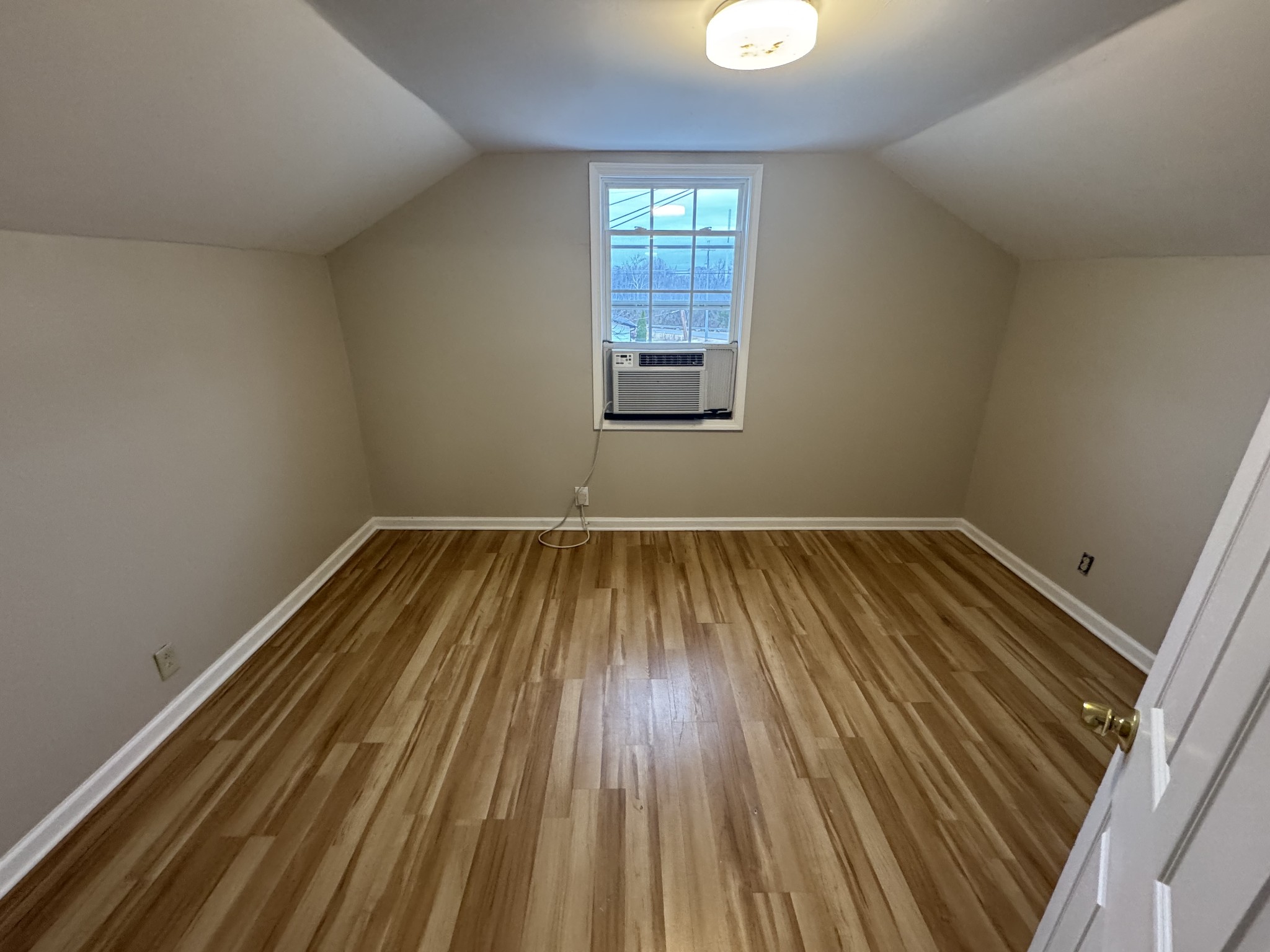 835 Bridge Avenue, Unit B Murfreesboro, TN 37129 - Photo 6 of 10 a view of a room with wooden floor and window