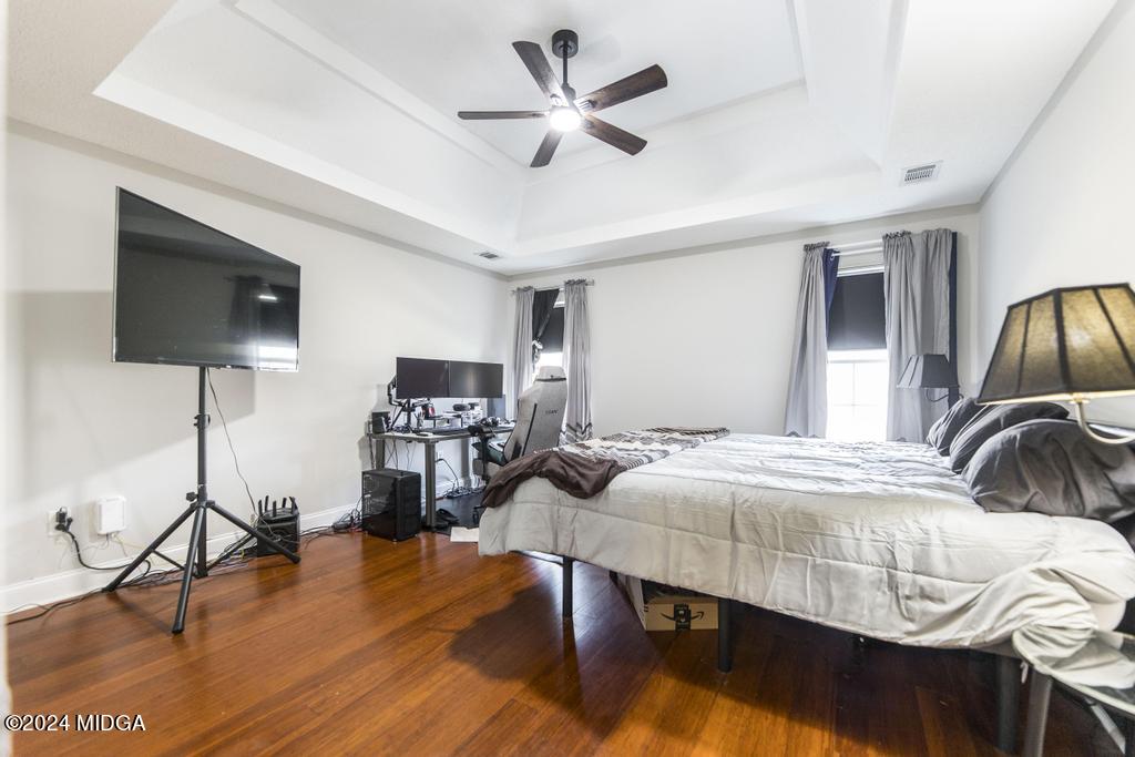 104 Weatherwood Road Kathleen, GA 31047 - Photo 16 of 35 a bedroom with furniture and a wooden floor