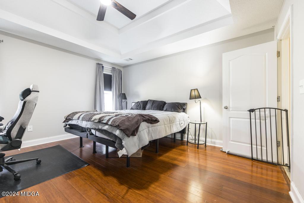 104 Weatherwood Road Kathleen, GA 31047 - Photo 17 of 35 a bedroom with furniture and a wooden floor