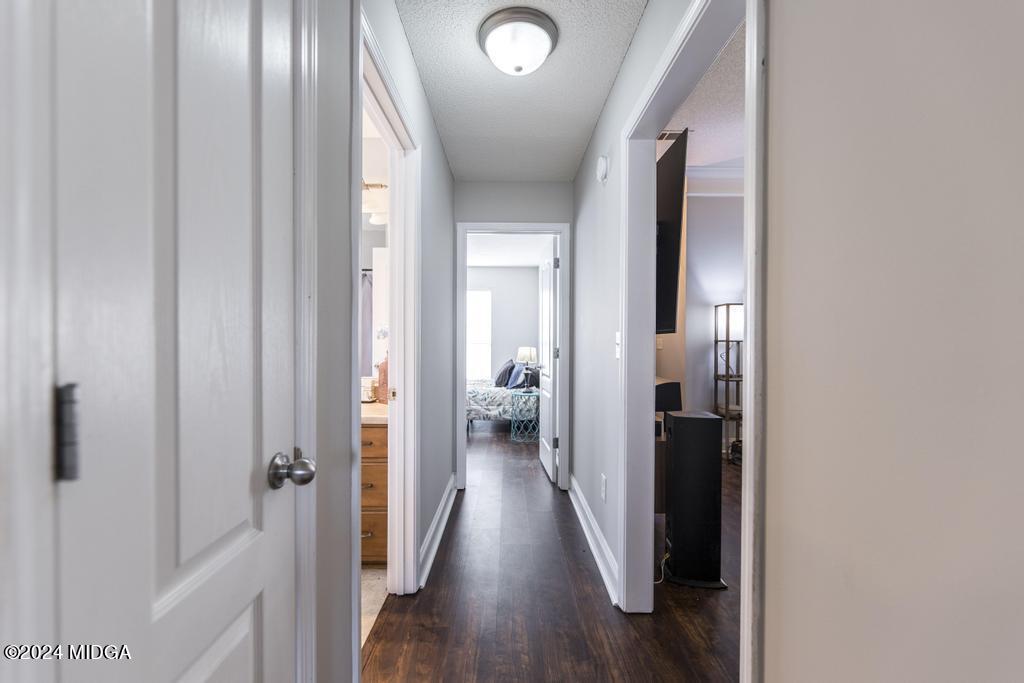 104 Weatherwood Road Kathleen, GA 31047 - Photo 23 of 35 a view of a hallway with wooden floor and a bathroom