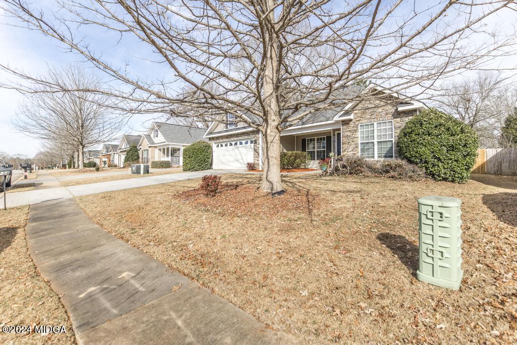 104 Weatherwood Road Kathleen, GA 31047 - Photo 4 of 35 a view of a yard with snow on the road