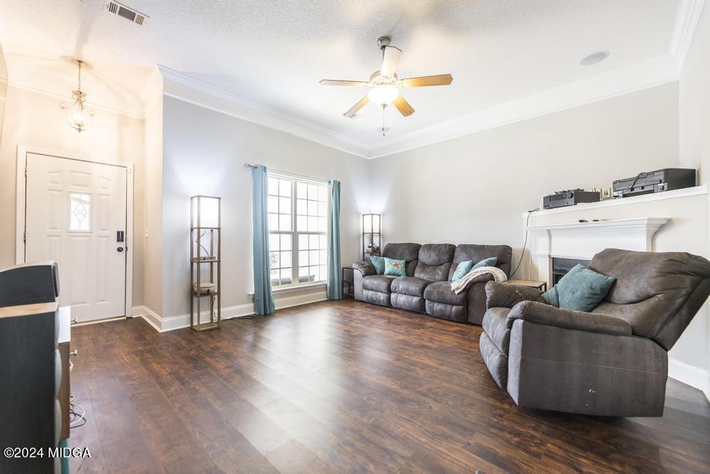 104 Weatherwood Road Kathleen, GA 31047 - Photo 8 of 35 a living room with furniture and wooden floor