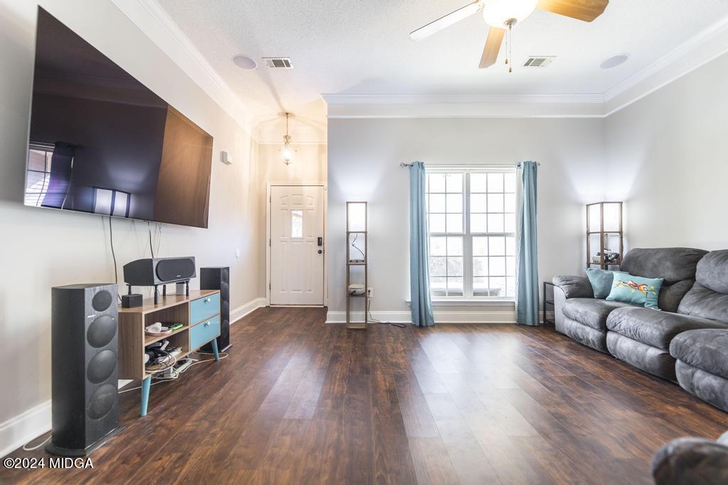104 Weatherwood Road Kathleen, GA 31047 - Photo 9 of 35 a living room with furniture and a flat screen tv