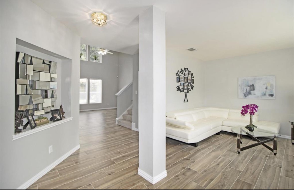 25507 Lyon Springs Court Spring, TX 77373 - Photo 2 of 9 a living room with furniture and wooden floor