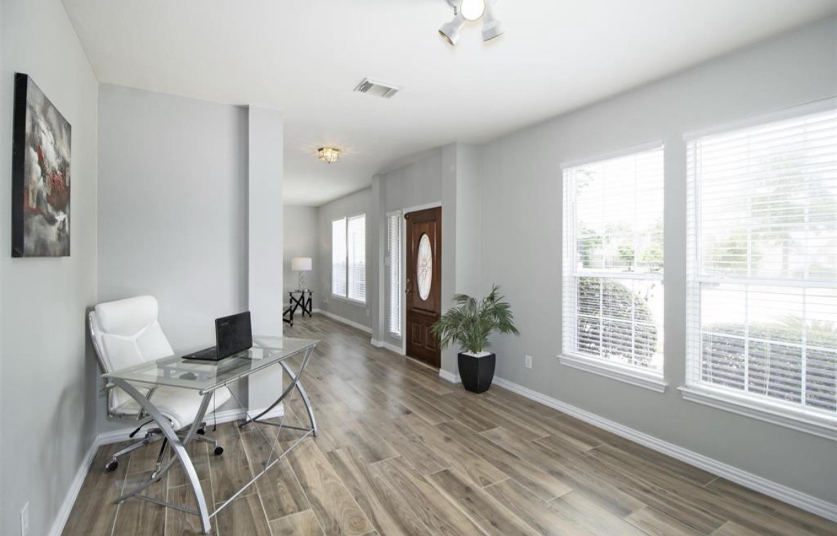 25507 Lyon Springs Court Spring, TX 77373 - Photo 4 of 9 a living room with furniture and wooden floor
