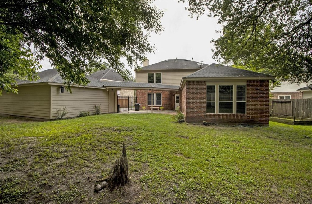 25507 Lyon Springs Court Spring, TX 77373 - Photo 9 of 9 a front view of a house with a garden