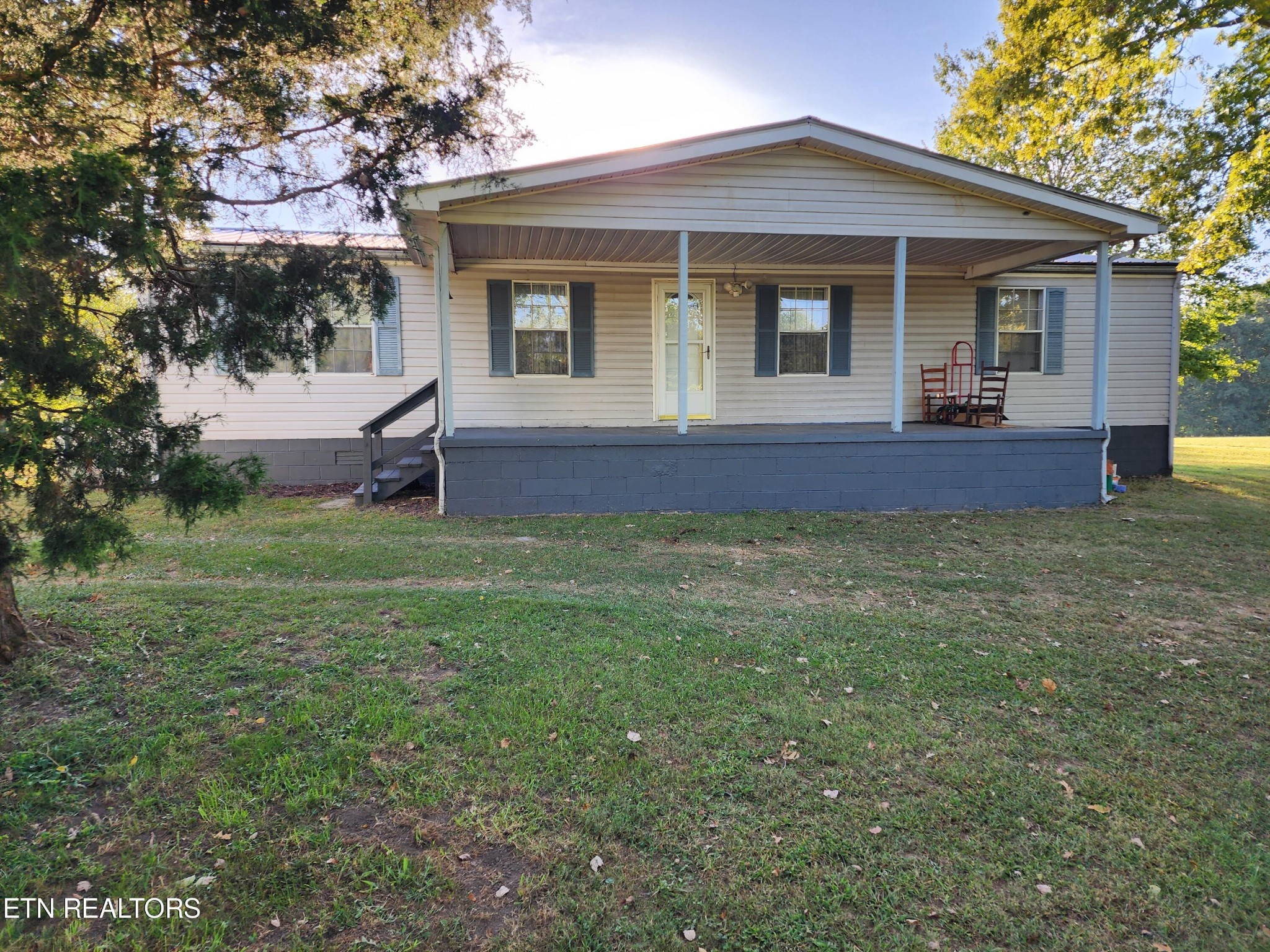 199 Carson Pugh Road Crossville, TN 38571 - Photo 1 of 58 a view of a house with a yard