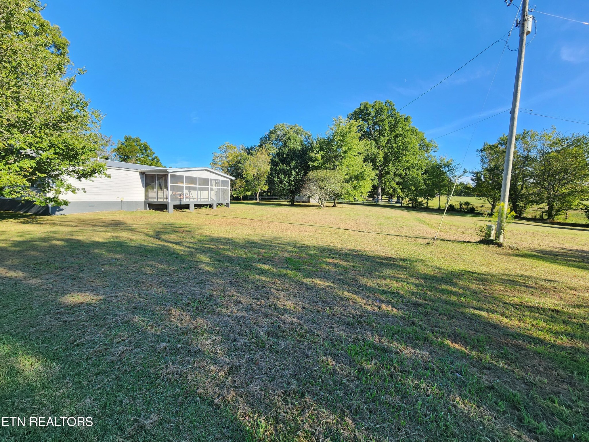 199 Carson Pugh Road Crossville, TN 38571 - Photo 15 of 58 a view of a house with a big yard