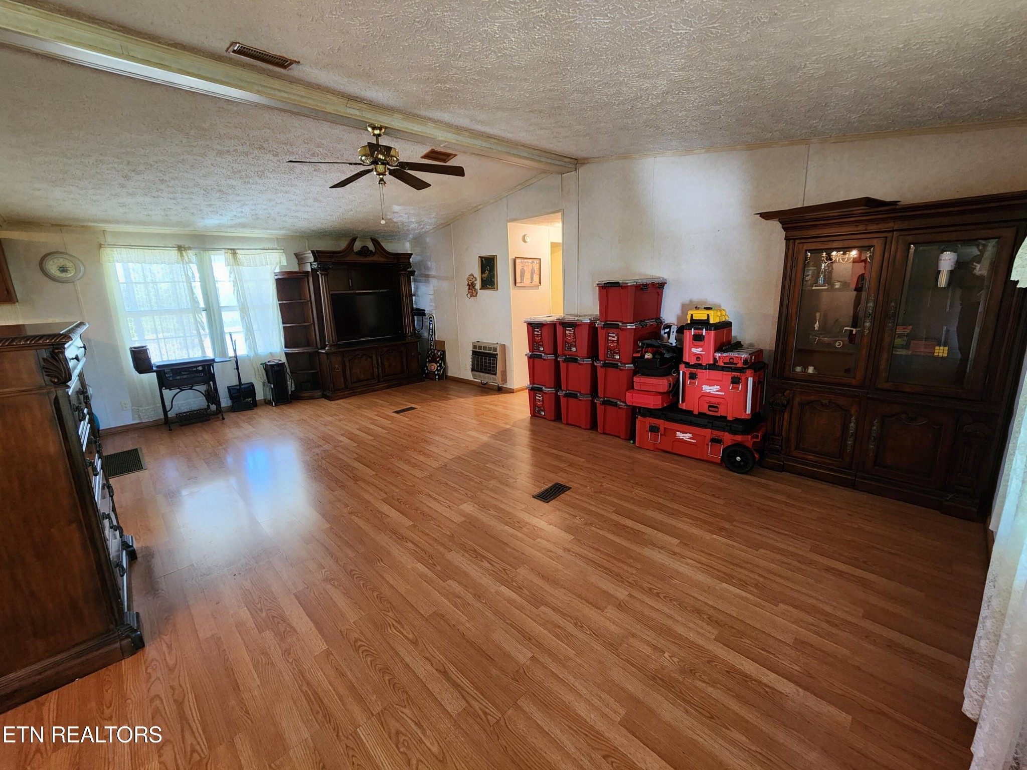 199 Carson Pugh Road Crossville, TN 38571 - Photo 40 of 58 a living room with furniture and wooden floor