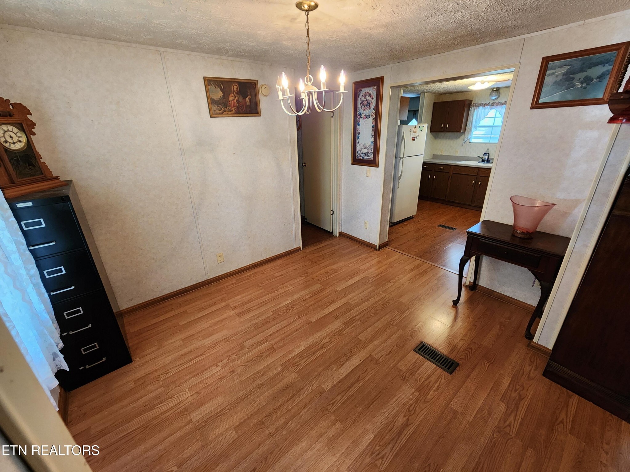199 Carson Pugh Road Crossville, TN 38571 - Photo 49 of 58 a view of a room with wooden floor and furniture