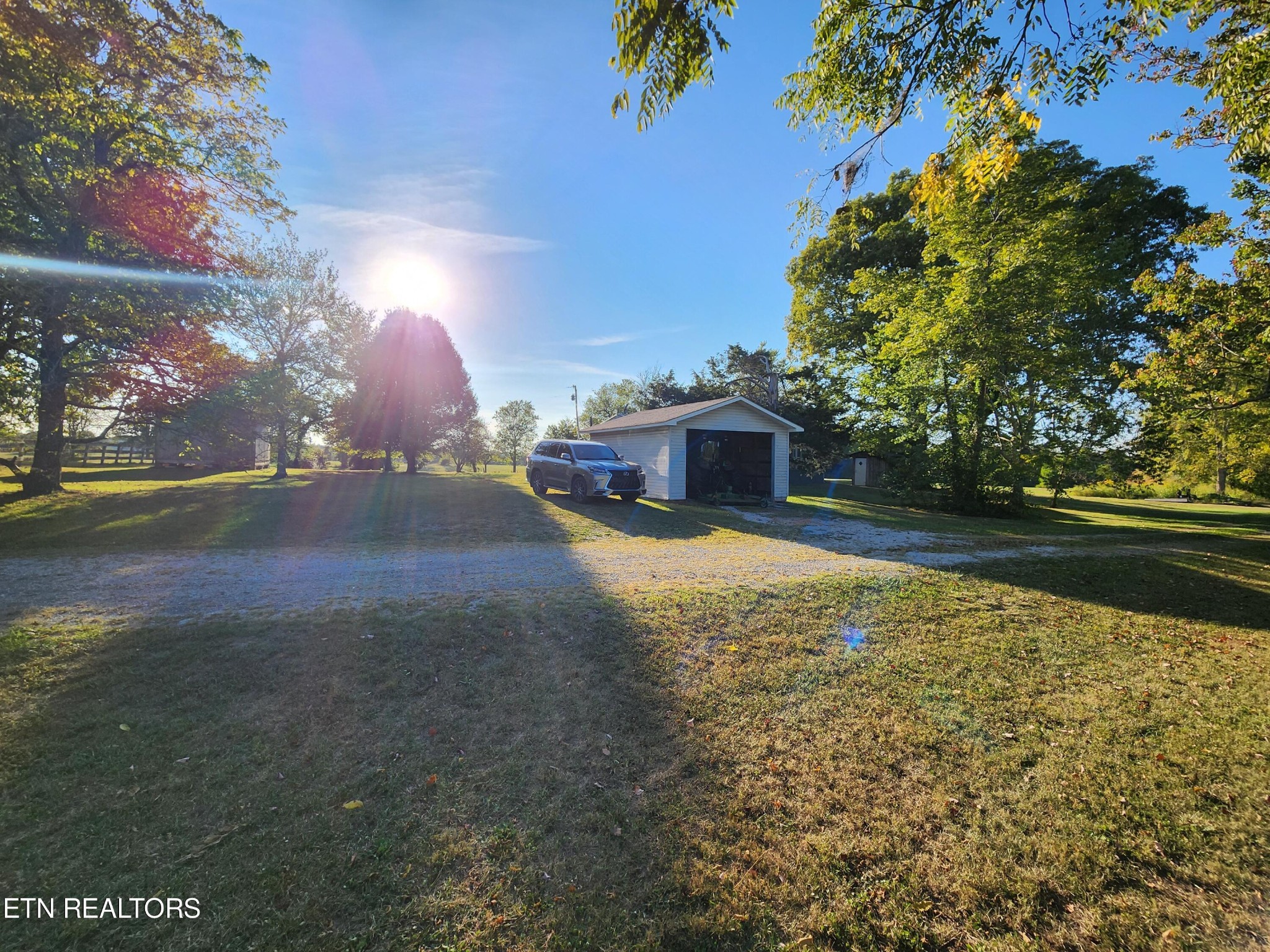 199 Carson Pugh Road Crossville, TN 38571 - Photo 5 of 58 a view of back yard of the house with swimming pool
