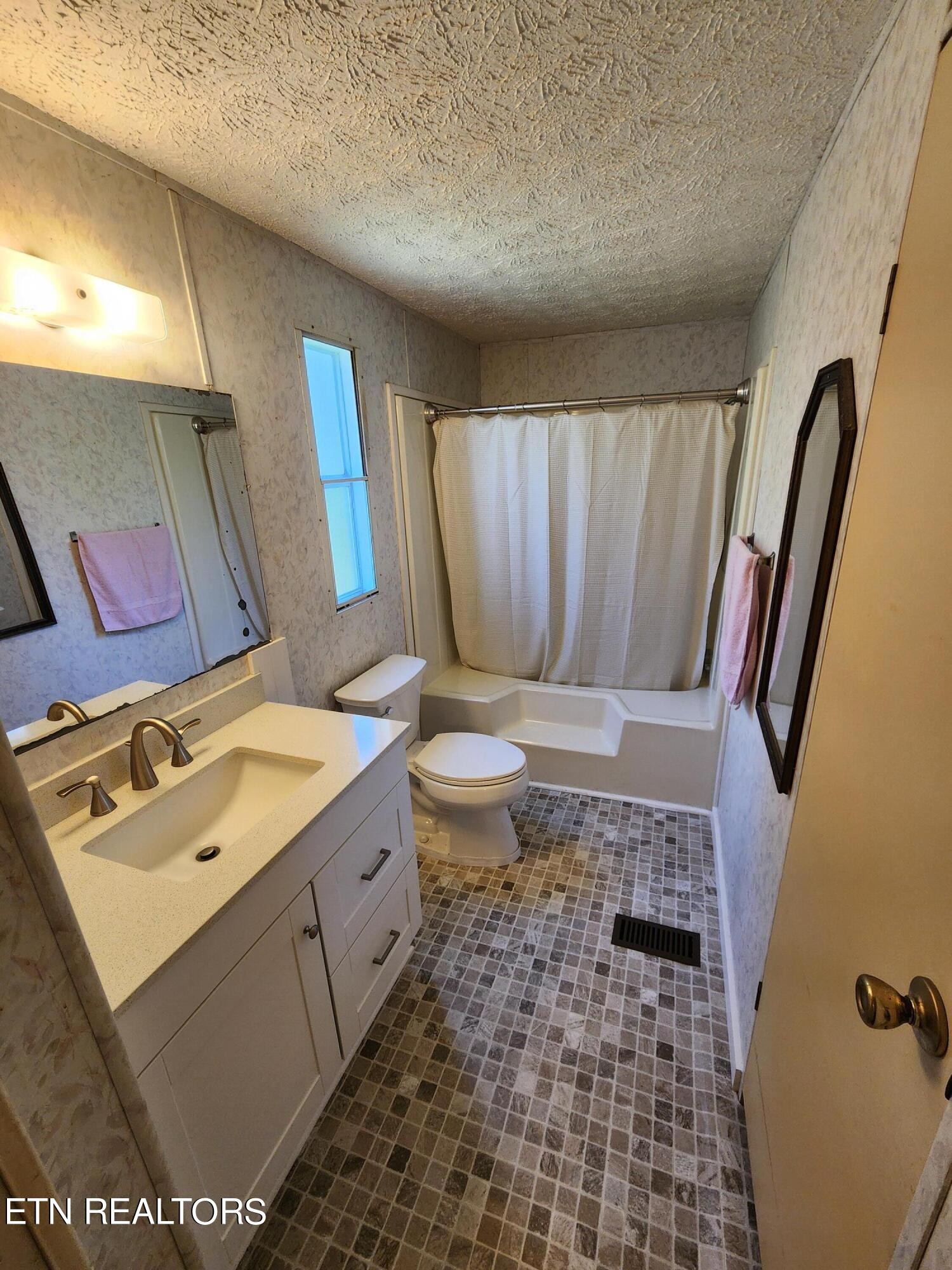 199 Carson Pugh Road Crossville, TN 38571 - Photo 52 of 58 a bathroom with a sink toilet and shower