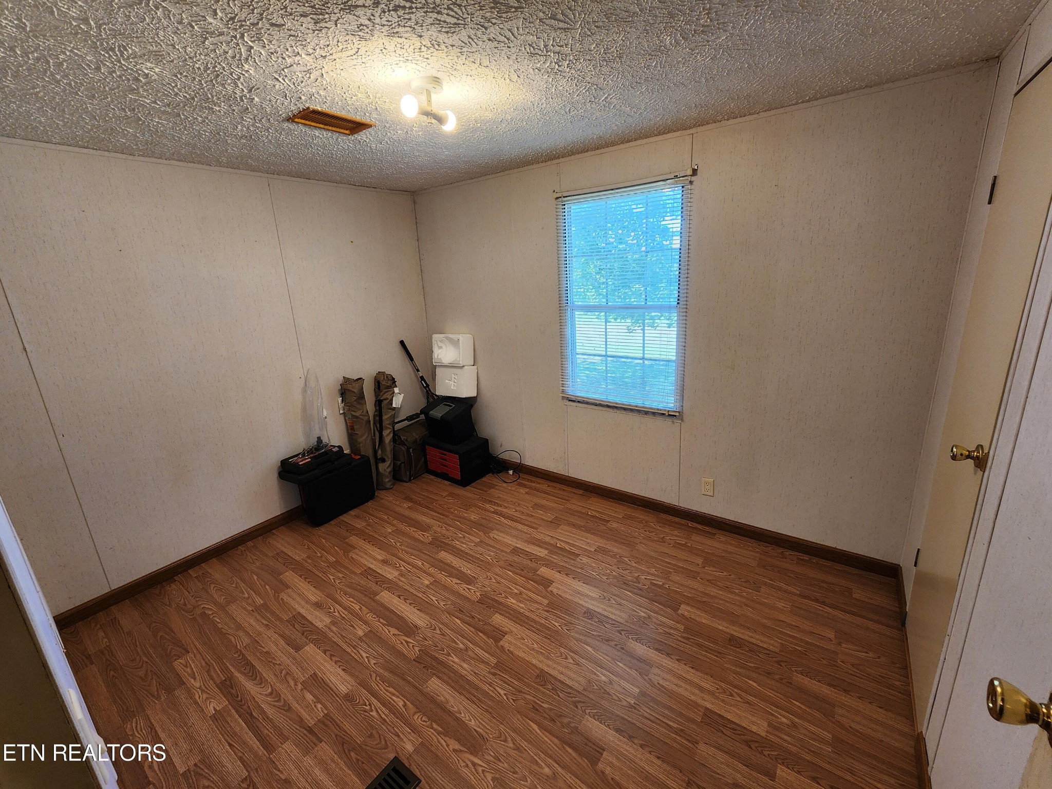 199 Carson Pugh Road Crossville, TN 38571 - Photo 54 of 58 a view of a room with wooden floor and windows