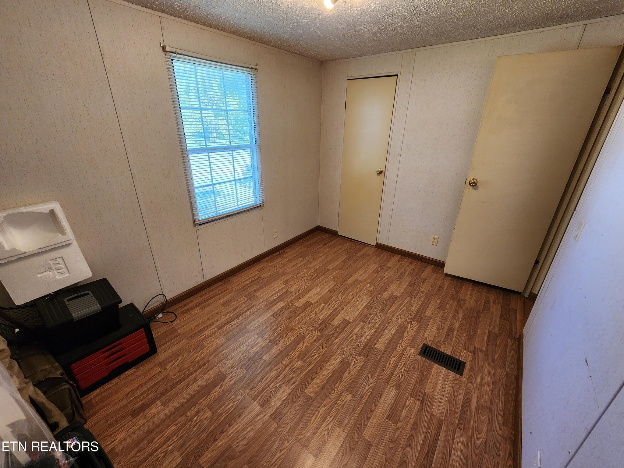 199 Carson Pugh Road Crossville, TN 38571 - Photo 55 of 58 a view of an empty room and wooden floor