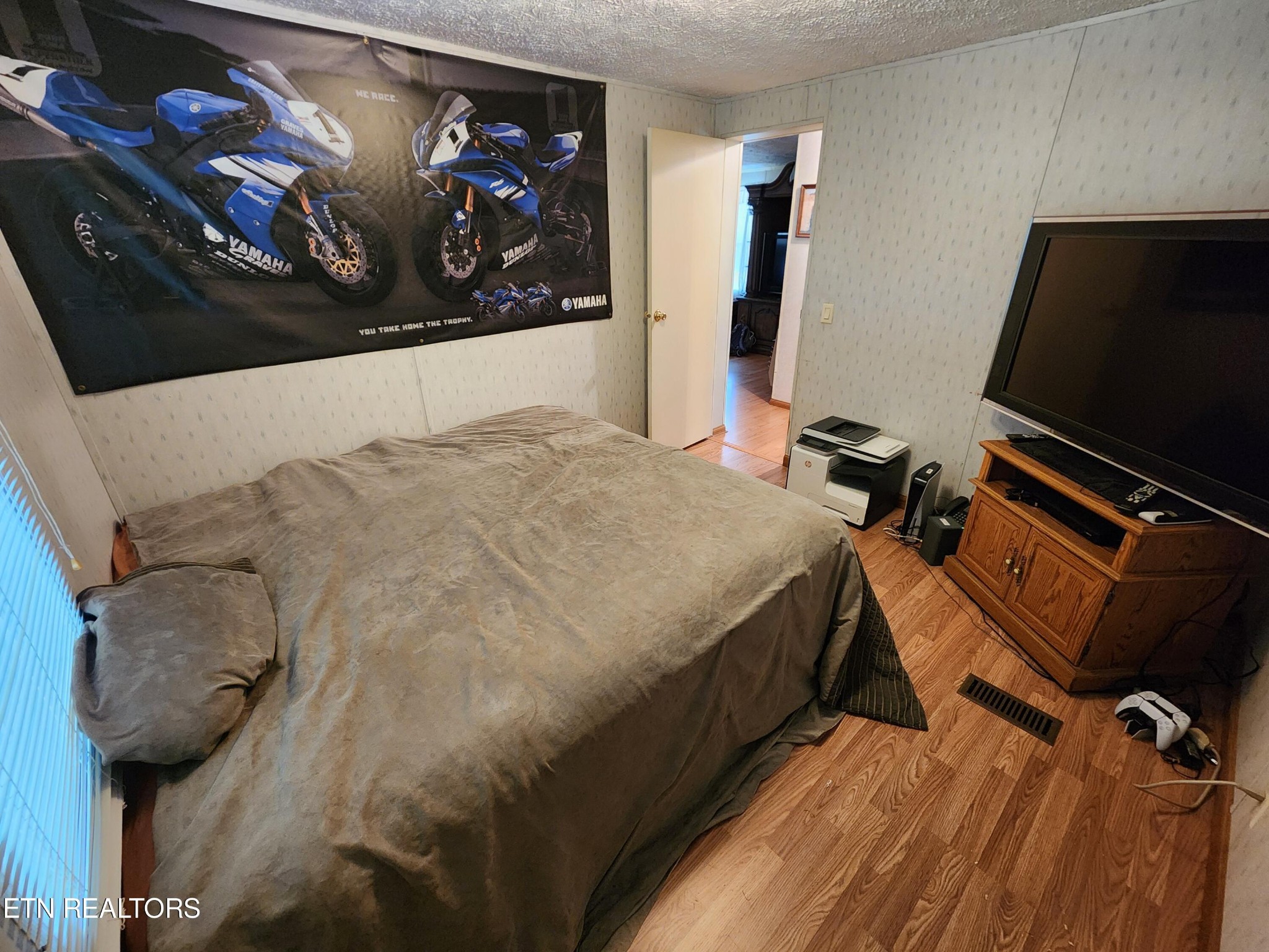 199 Carson Pugh Road Crossville, TN 38571 - Photo 57 of 58 a bed sitting in a bedroom next to a window