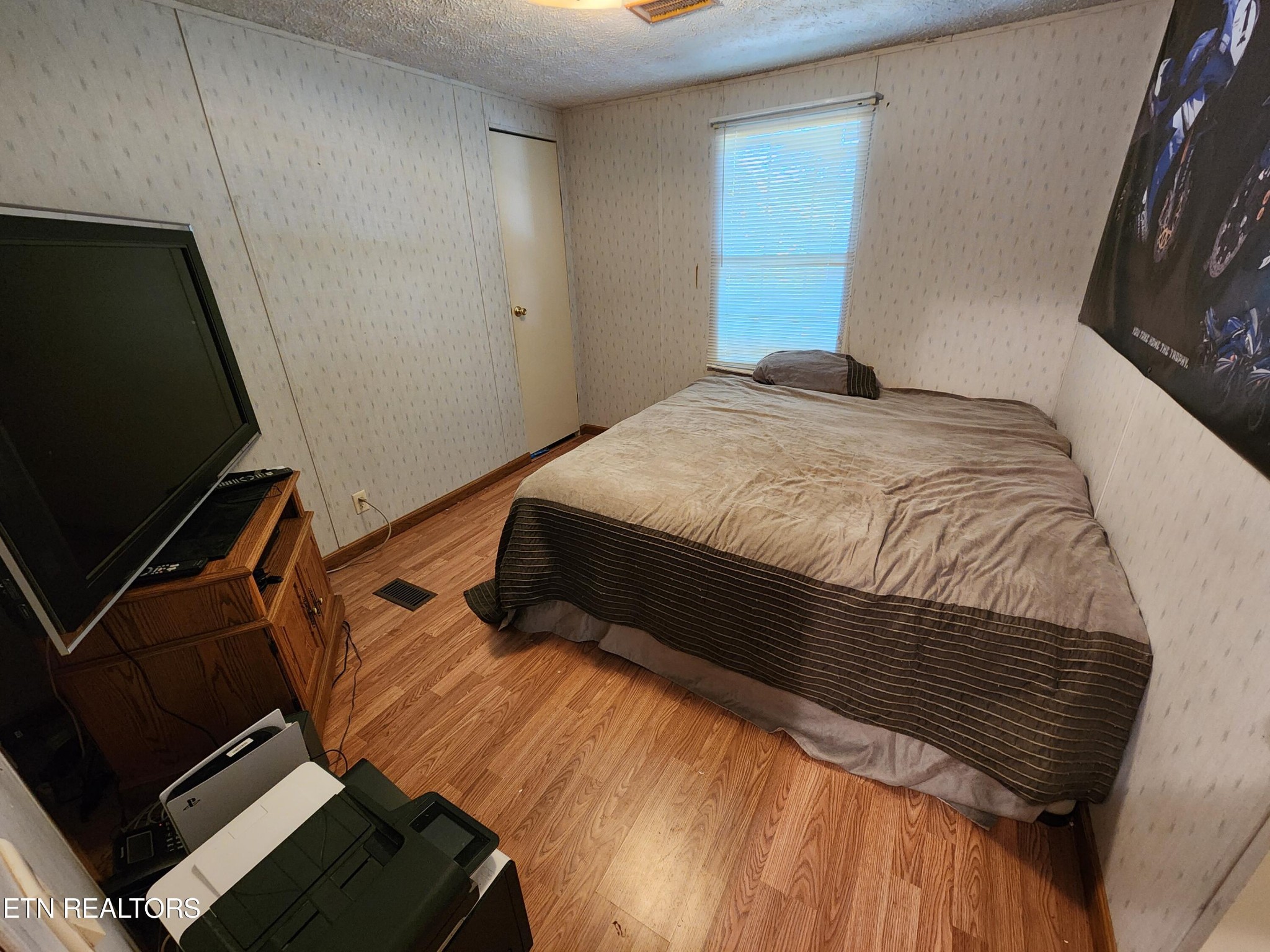 199 Carson Pugh Road Crossville, TN 38571 - Photo 58 of 58 a bedroom with a bed and mirror