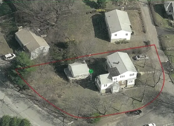 an aerial view of a house with outdoor space